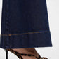 Détail jambe / ourlet : détail jambe large flare jean brut ourlet cru coupe 70s

