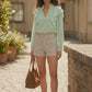 Short taille haute à rayures femme porté avec sandales plates